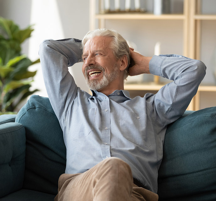 older man smiling and relaxing